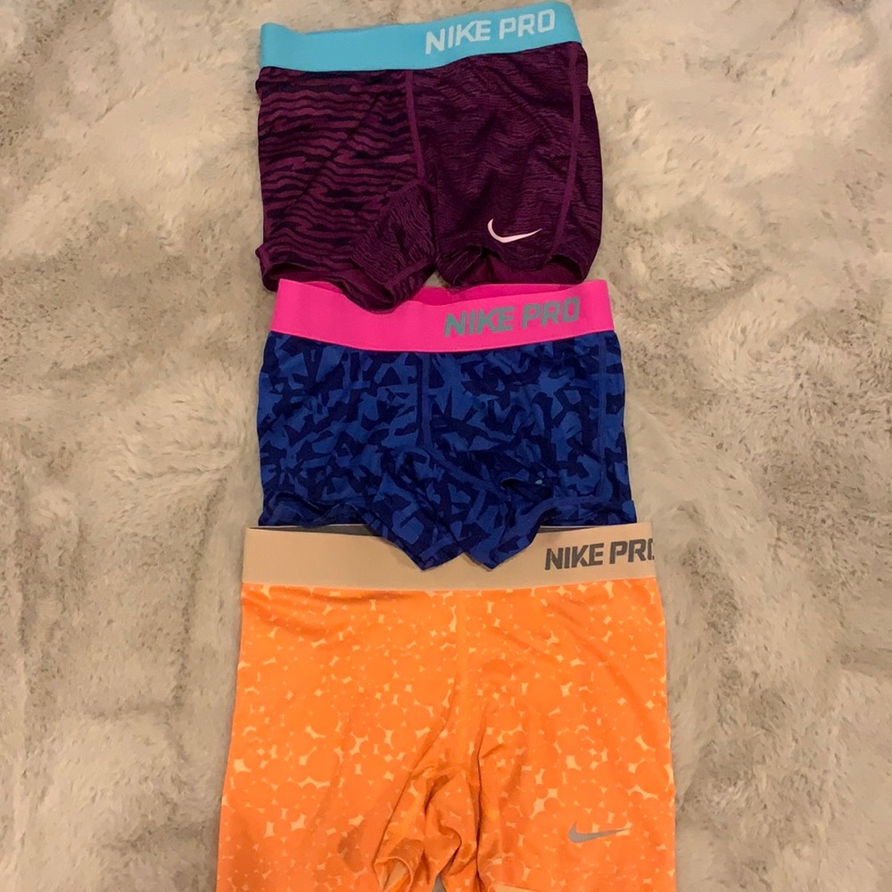 Three Nike pro shorts youth small
